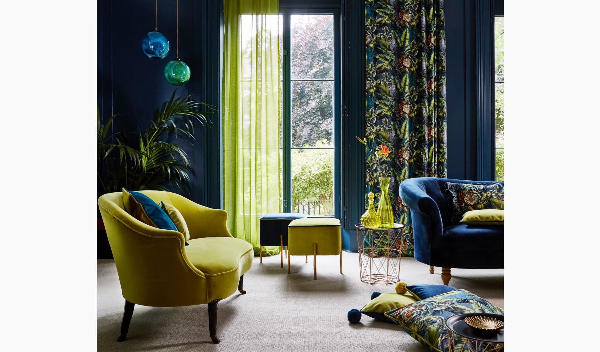 Jungle-patterned fabrics in a grand room